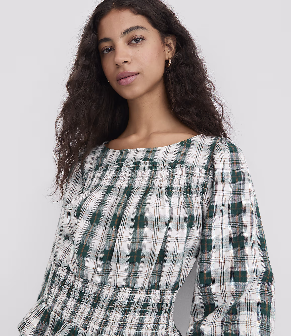 Close view of the emerald ivory plaid top with smocked waist detail