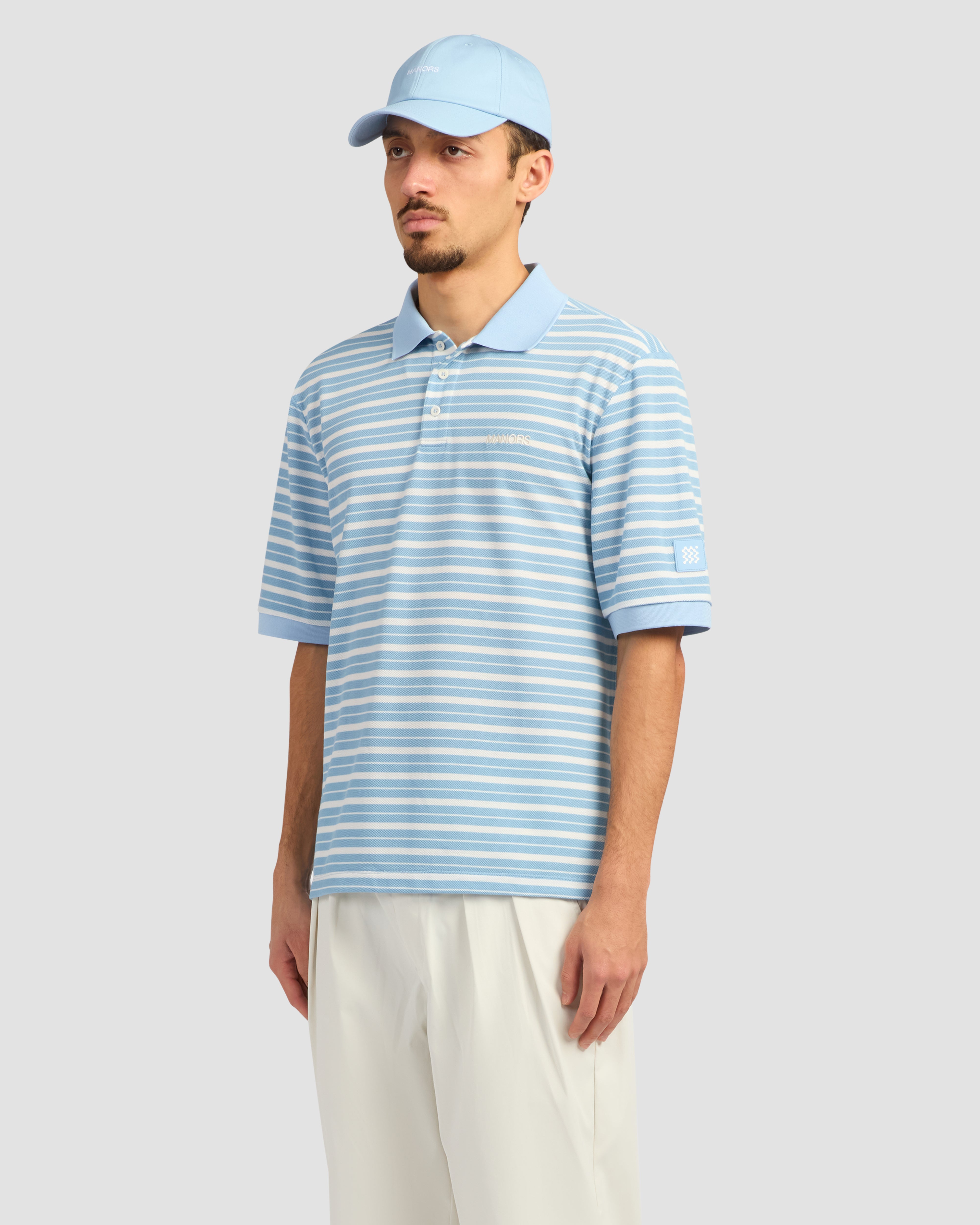 Jolidee Sky Blue GOAT Pique Polo offering a vibrant classic look for professional athletes