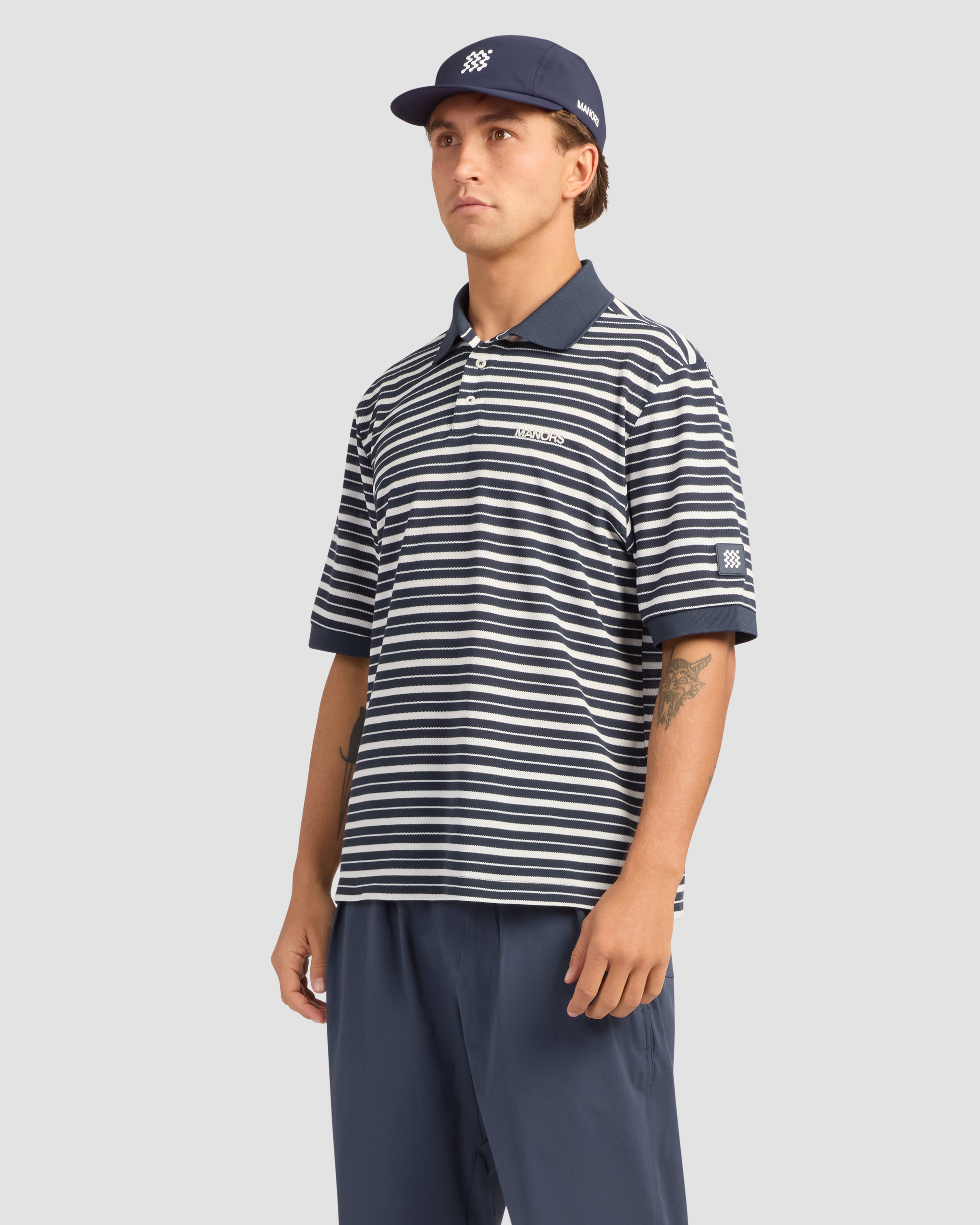 Jolidee Navy Blue GOAT Pique Polo featuring a timeless piqué weave for the modern course