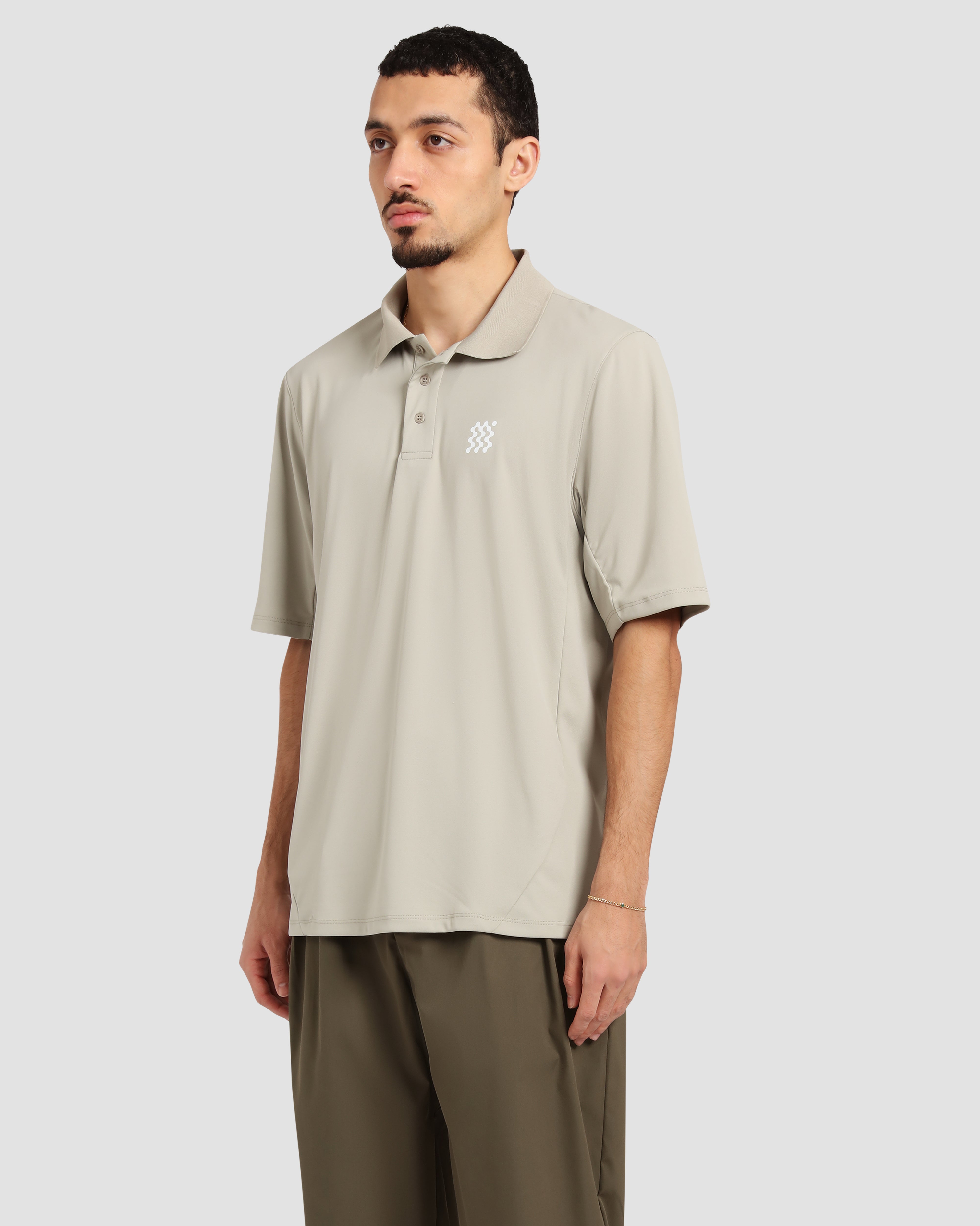 Jolidee Dune Beige Course Polo featuring a lightweight athletic fit perfect for warm days