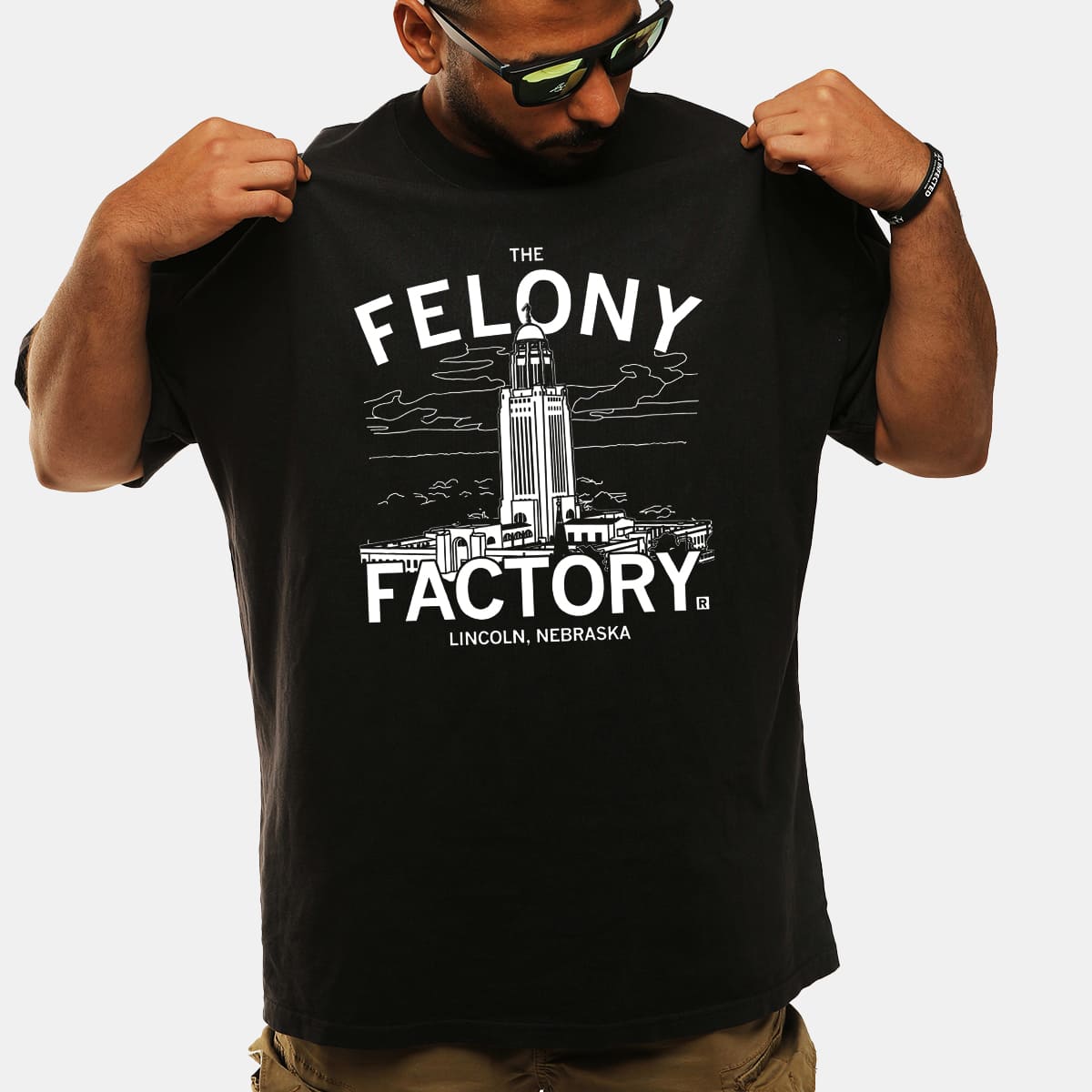The Felony Factory Lincoln Nebraska Crime Parody Graphic Tee Local Streetwear Shirt Gift for Nebraska Fans
