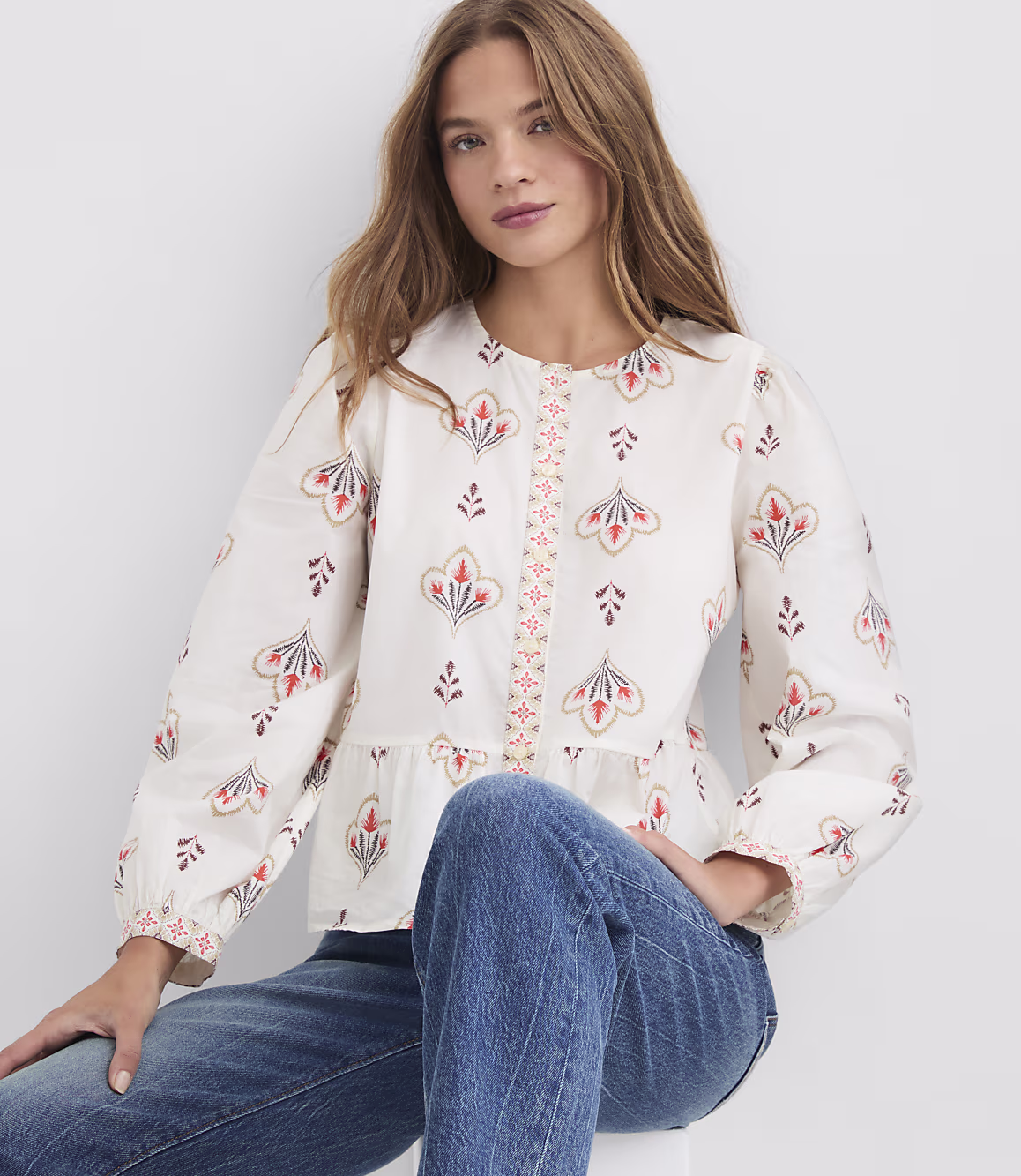 Ivory floral Zarevia peplum top styled for everyday wear