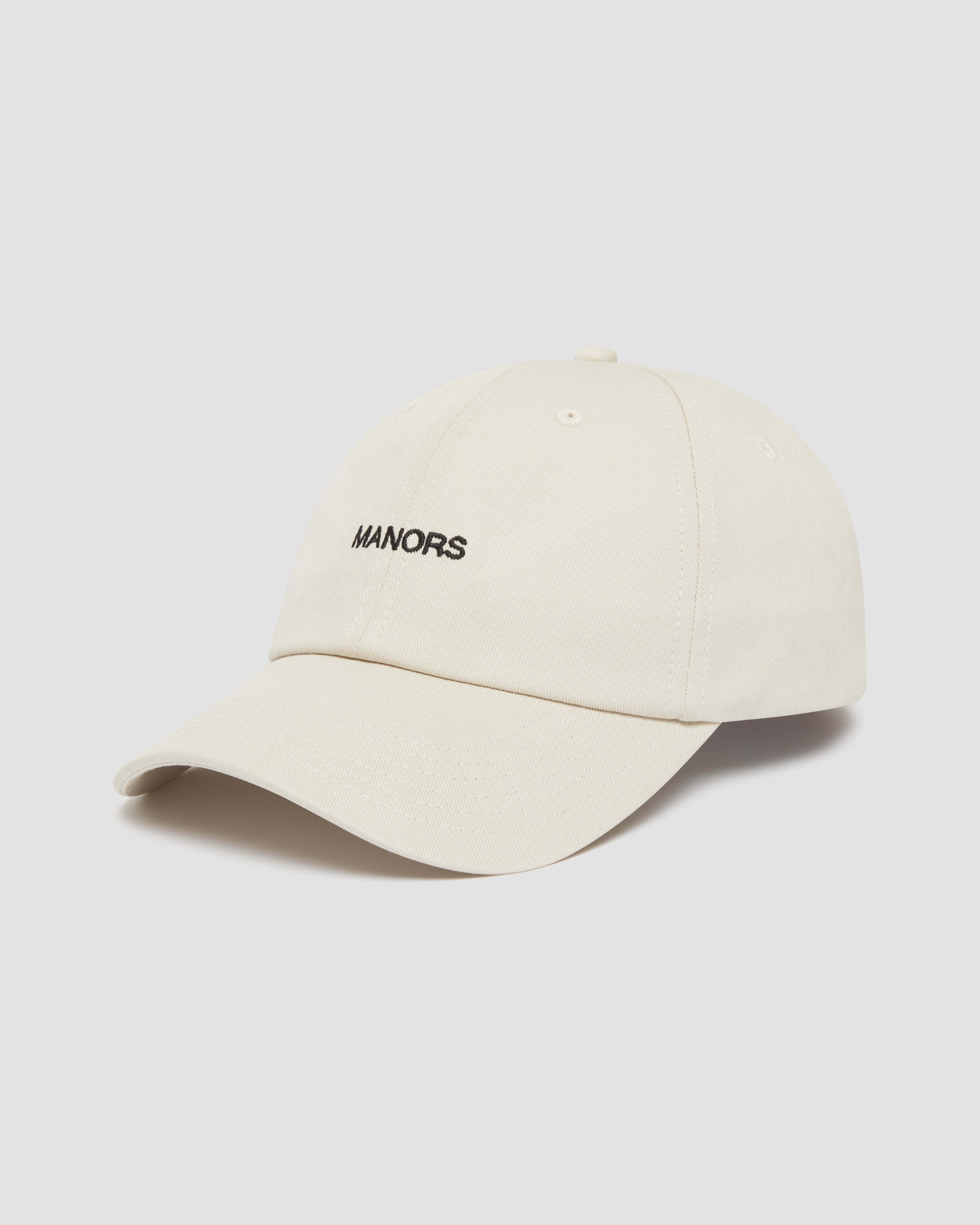 Jolidee Ivory Chino Cap featuring an adjustable strap for the perfect custom fit on the green