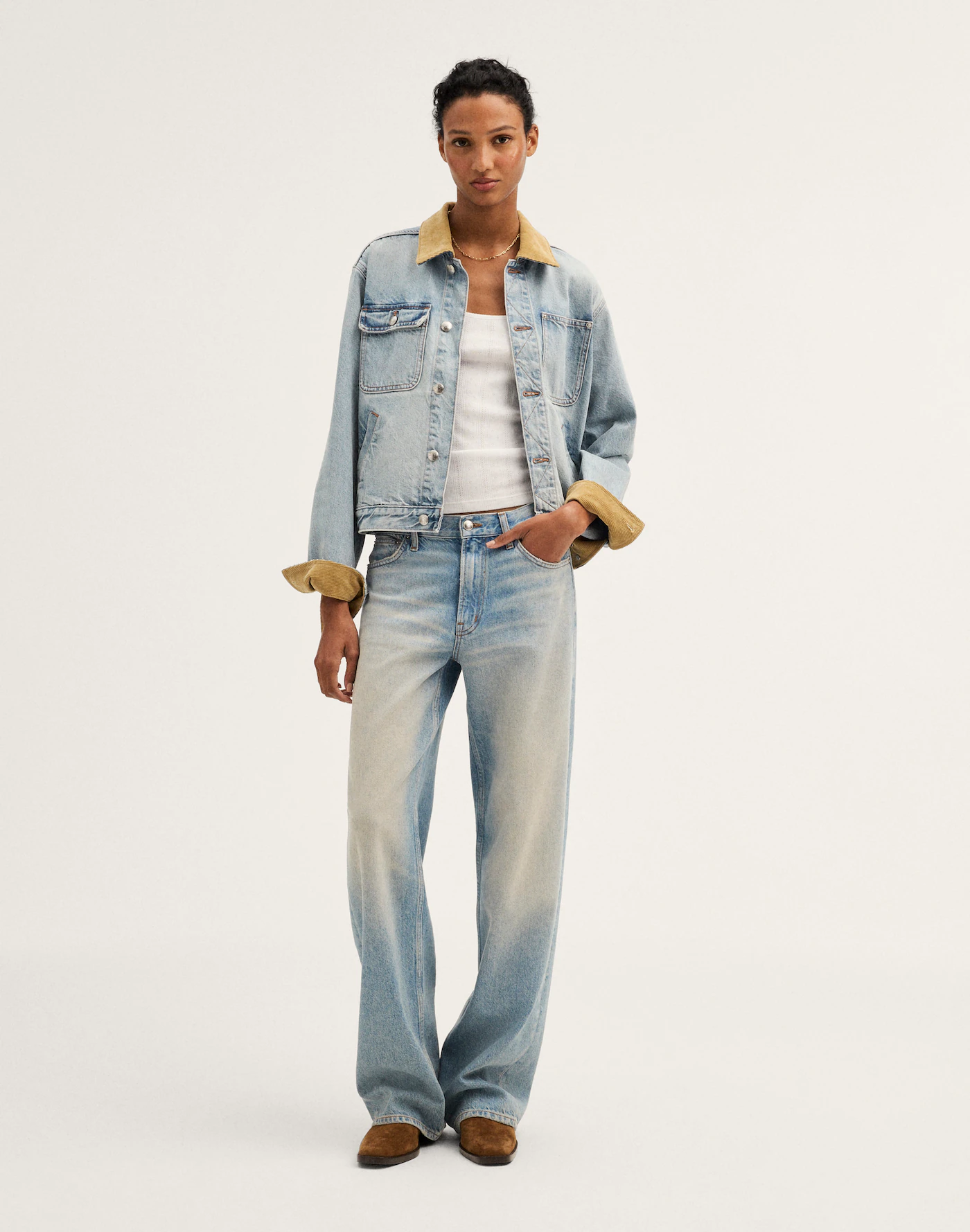 Light blue washed denim jacket with tan contrast collar and cuffs